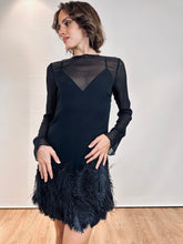 Abito in tulle e piume