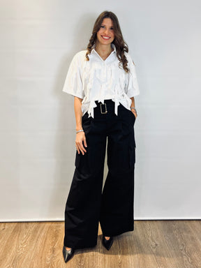 Polo con applicazioni fiocchi