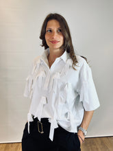 Polo con applicazioni fiocchi