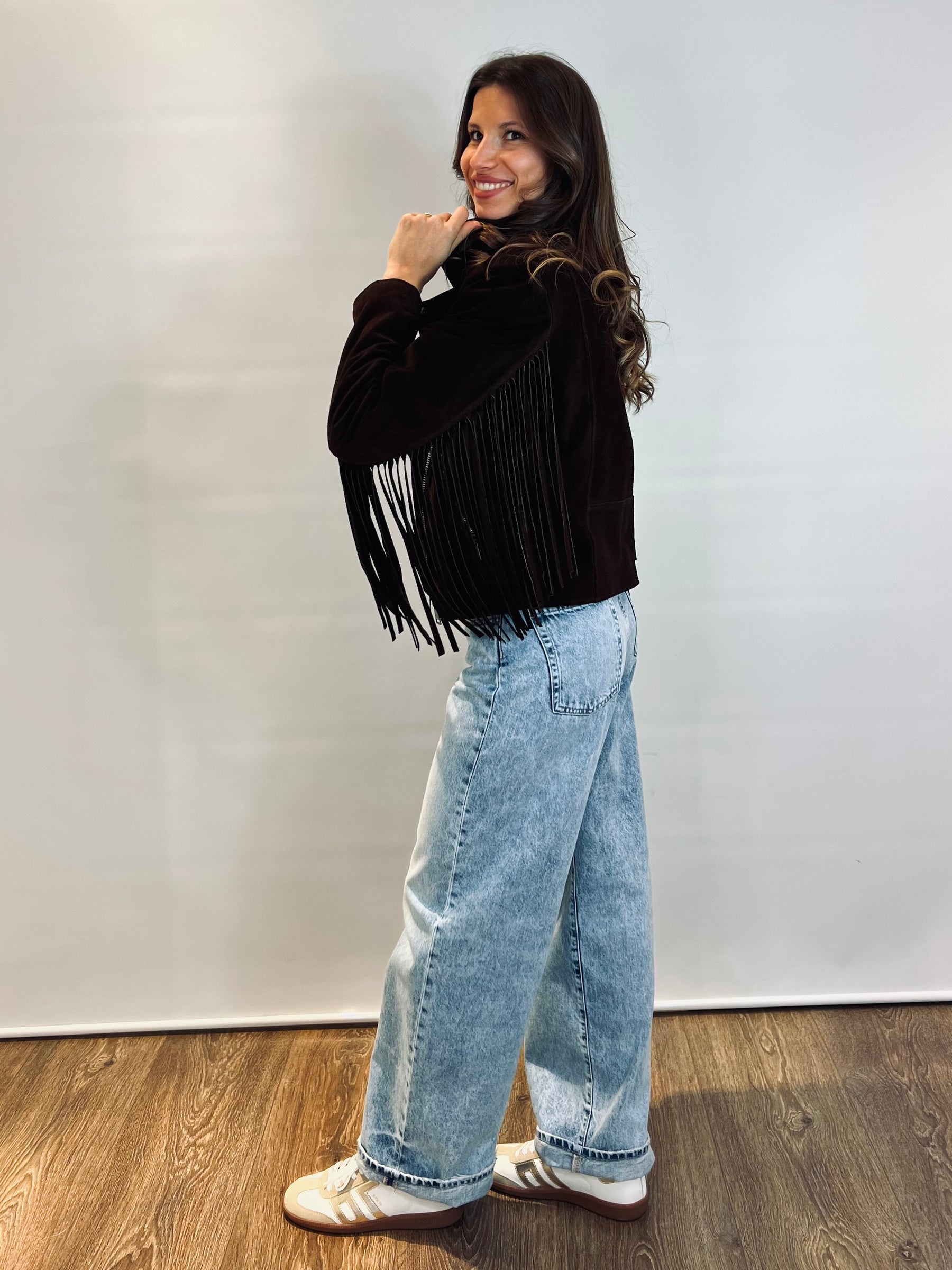 Chiodo in suede con frange