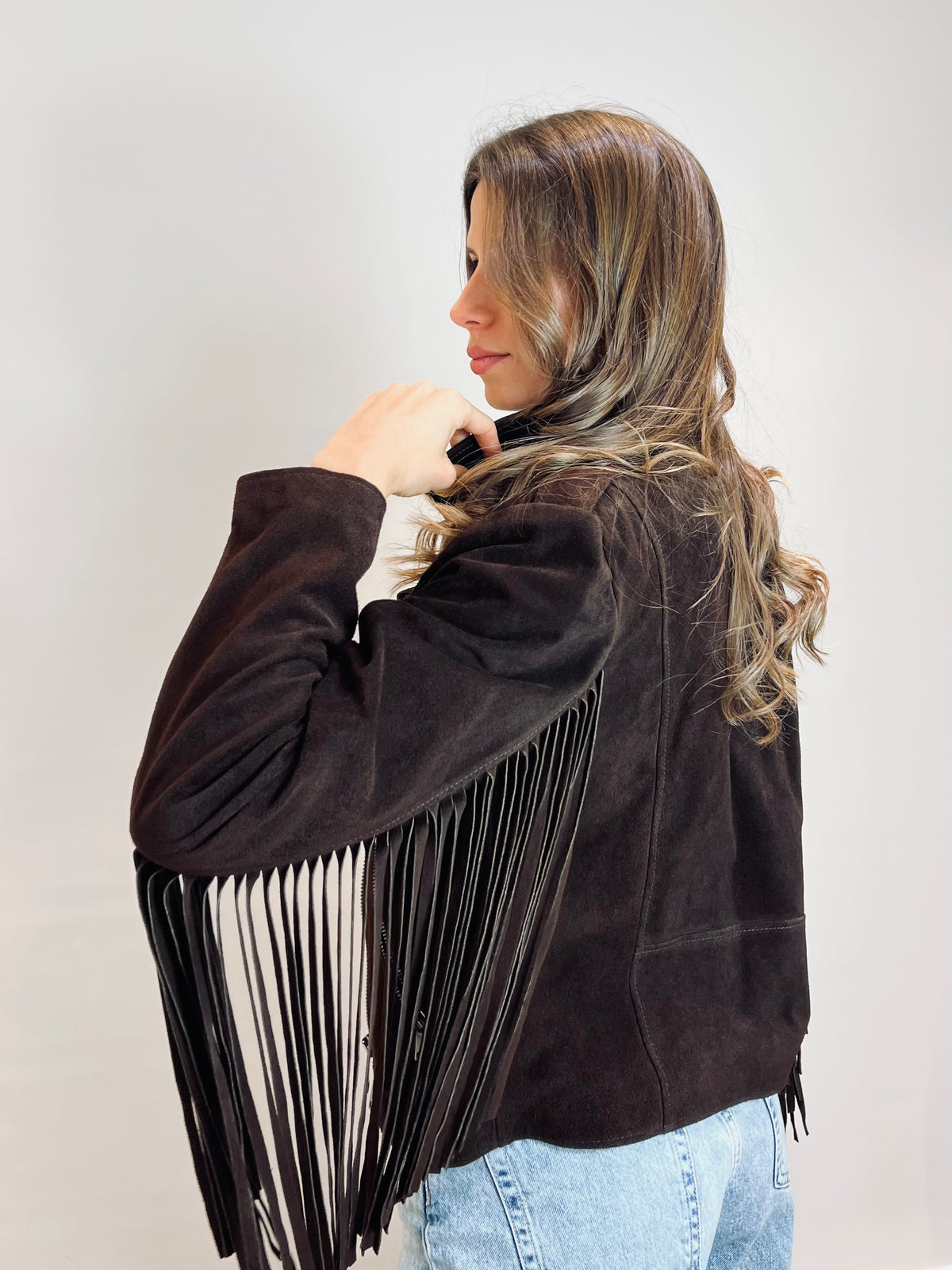 Chiodo in suede con frange