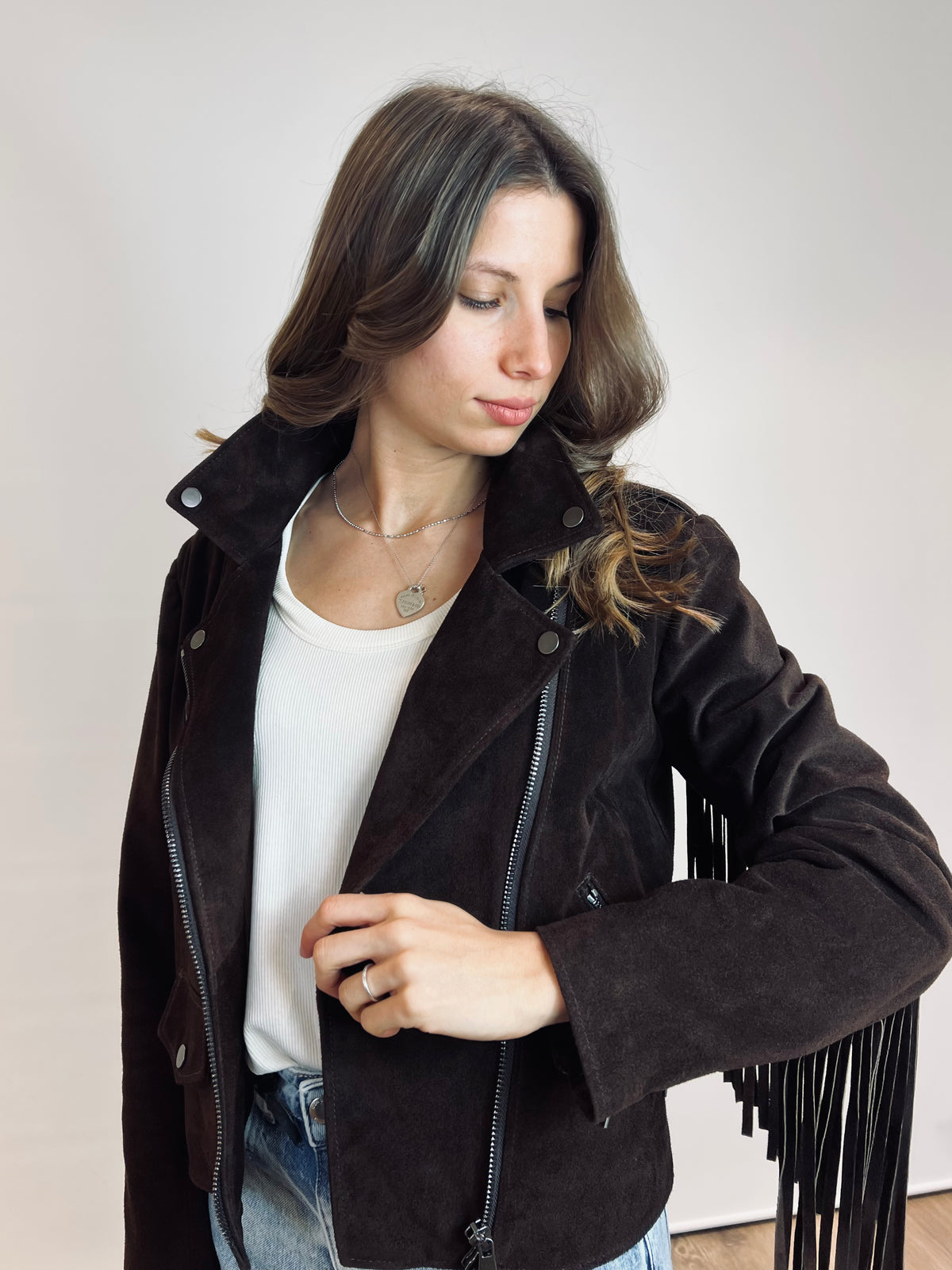 Chiodo in suede con frange